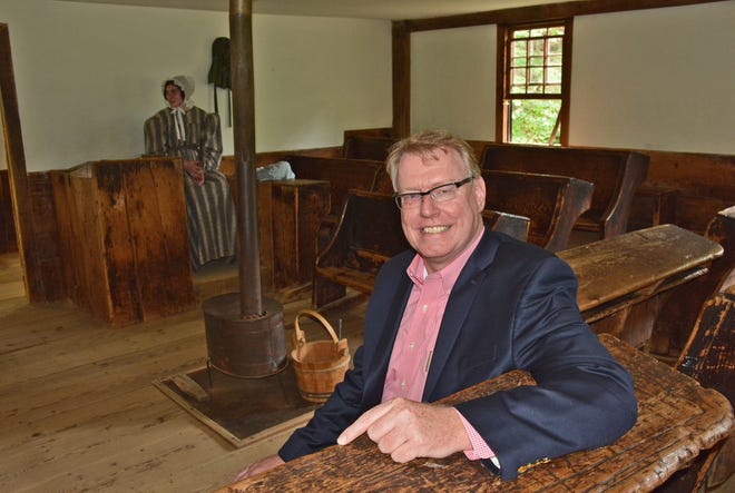 Old Sturbridge Village CEO Jim Donahue in 2015 inside the one-room schoolhouse at the living history museum, which has received state approval for a charter school. [File Photo/Chris Christo]