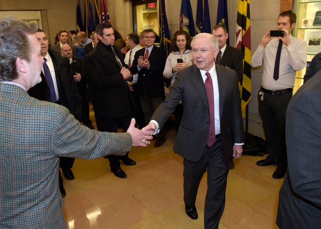 Attorney General Jeff Sessions is greeted by employees as he arrives at the Justice Department in Washington. The federal prison population is on the decline, but a new attorney general who talks tough on drugs and crime could usher in a reversal of that trend. The resources of a prison system that for years has grappled with overcrowding, but that experienced a population drop as Justice Department leaders pushed a different approach to drug prosecutions, could again be taxed. (AP Photo/Susan Walsh, File)