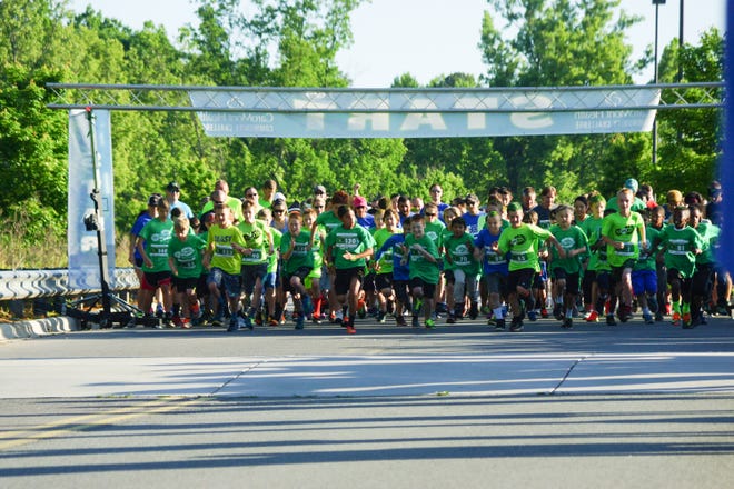 The start of last year's run. CaroMont Community Challenge, which includes a 5k run and 1-mile fun walk takes place on May 13 at Stuart W. Cramer High School in Belmont. [CAROMONT HEALTH PHOTOS]