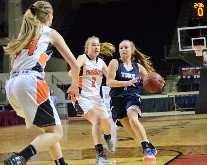 York senior Maddie Cogger, right, attacks Brunswick defenders Charlotte MacMillan (2) and Brooke Barter off the dribble during last Wednesday’s Class A South semifinal game at Cross Insurance Arena in Portland. [Ryan O’Leary/Seacoastonline]