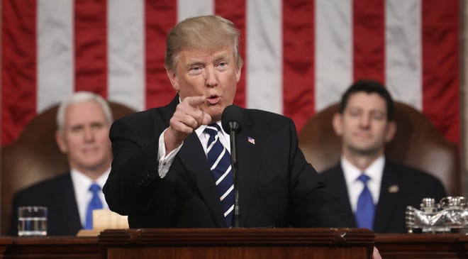 main shot for A1



President Donald Trump addresses a joint session of Congress on Tuesday night. Vice President Mike Pence and House Speaker Paul Ryan are in the background. [Jim Lo Scalzo/Pool]