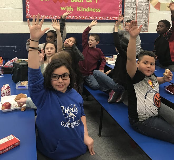 Above, Kim Thompson’s fourth grade class votes on the new cafeteria name. [Photo provided]