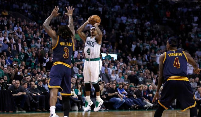 Boston Celtics guard Isaiah Thomas hits a 3-pointer in the final minute against the Cleveland Cavaliers during an NBA basketball game in Boston, Wednesday, March 1, 2017. Thomas scored 31 points as the Celtics defeated the Cavaliers 103-99.