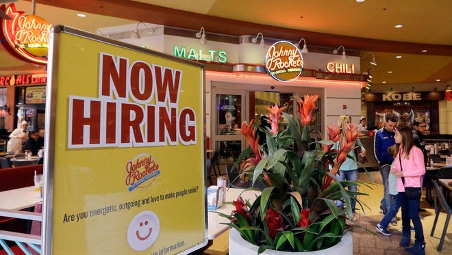 A restaurant posts a sign indicating they are hiring, in Miami in this Feb. 9, 2016 f. (Alan Diaz/Associated Press)