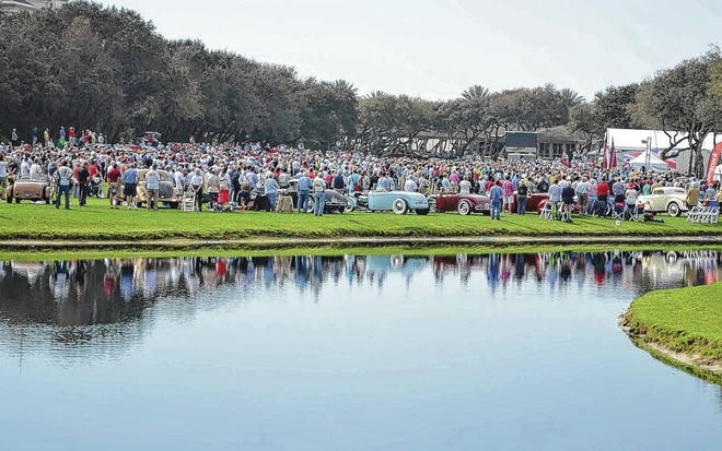 A row of classic hot rods lined a lake at the 20th annual Amelia Island Concours d'Elegance in 2015. Another large crowd of more than 25,000 is expected on Saturday as the show was moved up a day because of heavy rain in Sunday's forecast. (Dan Scanlan/Florida Times-Union)