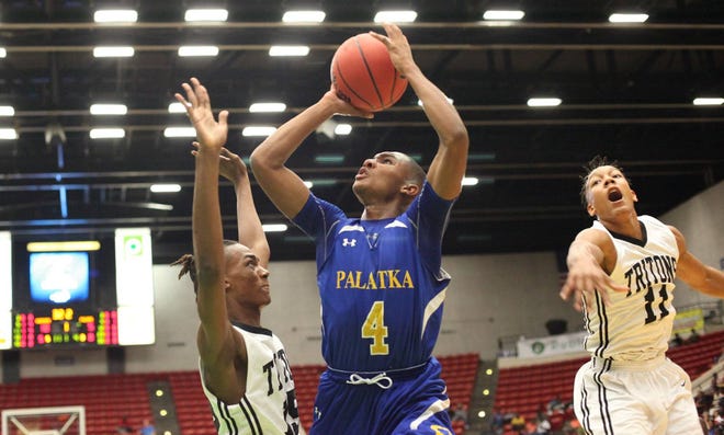 Palatka’s Chamar Dumas goes up for a shot against Cape Coral Mariner in the Class 6A boys basketball state semifinals on Thursday in Lakeland. Mariner won 64-28. (Cindy Skop, for the Times-Union)
