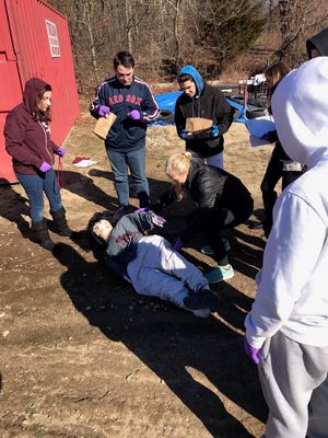West Bridgewater students investigated a mock crime scene on Friday, March 3,2017 to uncover who killed Bernadette.