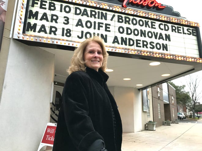 Bobbi Gibson poses at the Don Gibson Theatre marquee in uptown Shelby. The venue is named for her late husband, a singer-songwriter and member of the Country Music Hall of Fame. Photos by Wade Allen.