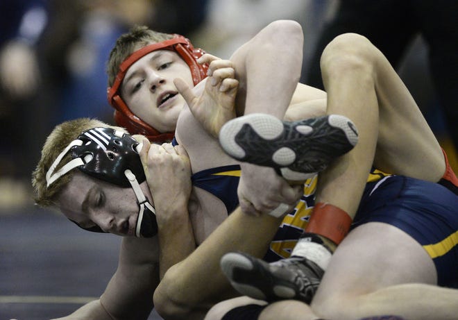 Moon's Nick Acuna (top) wrestles Mars' Jake Richardson in the 138-pound weight class during the Midwestern Athletic Conference Tournament on Jan. 7 at Hopewell High School. Acuna advanced to the PIAA wrestling tournament Saturday by making the top four in his weight class in the WPIAL 3A championships.