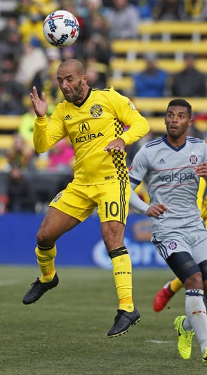 The Crew's Federico Higuain gets to the ball before Johan Kappelhof of the Fire can. [Eric Albrecht/Dispatch