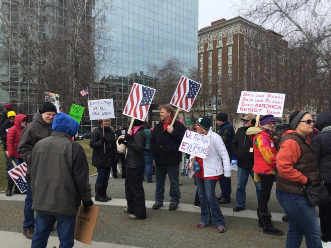 Anti-President Donald Trump protesters gather at Rosa Parks Circle in downtown Grand Rapids on Saturday, March 4. Jordan Climie/Sentinel staff