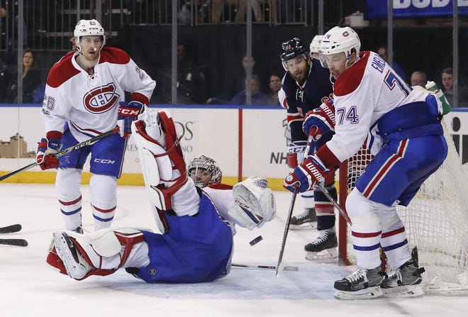 Montreal Canadiens goalie Carey Price (31) deflects a shot by the Rangers during the second period of Saturday night's game at Madison Square Garden. [The Associated Press]