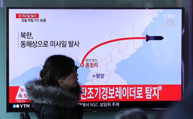 A visitor walks by the TV screen showing a news program reporting about North Korea’s missile firing, at Seoul Train Station in Seoul, South Korea, Monday, March 6, 2017. North Korea on Monday fired four banned ballistic missiles that flew about 1,000 kilometers (620 miles), with three of them landing in Japan’s exclusive economic zone, South Korean and Japanese officials said, in an apparent reaction to huge military drills by Washington and Seoul that Pyongyang insists are an invasion rehearsal. The letters on the top read ” North Korea, Fire missile.” (AP Photo/Lee Jin-man)