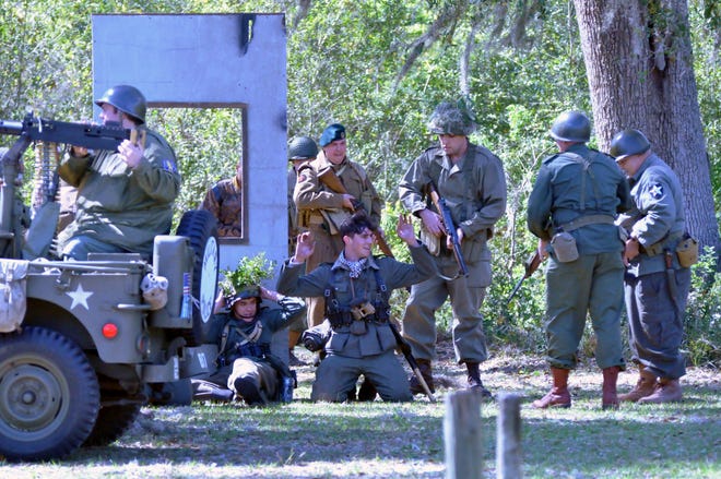The Americans have prevailed, and are taking prisoners at the WWII reenactment at Dade Battlefield Historic State Park on Saturday. [LINDA CHARLTON / CORRESPONDENT]