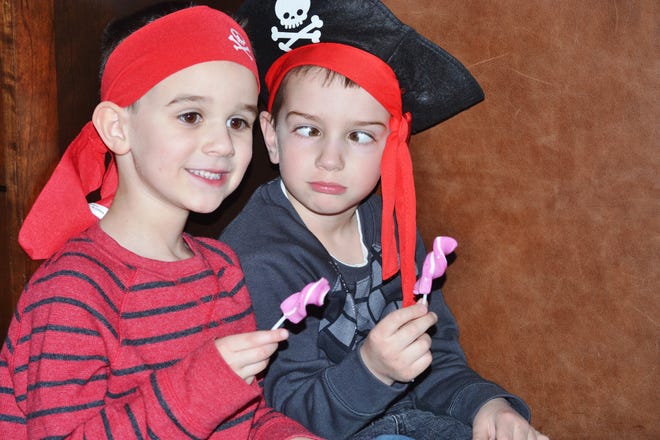 Arrrrr! Pirates and friends Owen Kettel, 5, and Eli Cohn, 5, both of Plainville ham it up at the Pirate and Princess dance party held at An Unlikely Story on Saturday, March 4. 

[Wicked Local Photo/Heather Gillis]