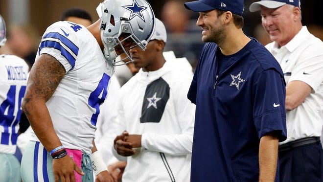 Dak Prescott #4, quarterback of the Dallas Cowboys talks with injured quarterback Tony Romo #8 prior to the game against the Cincinnati Bengals at AT&T Stadium on October 9, 2016 in Arlington, Texas. (Photo by Wesley Hitt/Getty Images)
