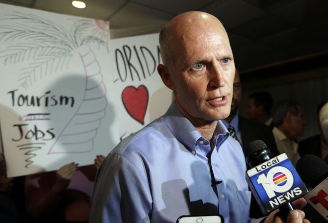 Gov. Rick Scott speaks March 2 with news media following a jobs roundtable about the economic impact of Visit Florida and Enterprise Florida in Hialeah. Scott is scheduled to give his annual State of the State address Tuesday, the first day of the Legislative Session, in Tallahassee. [Associated Press/Lynne Sladky]