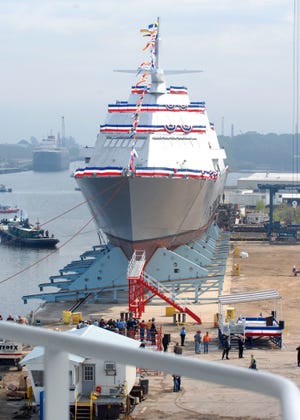 The nation’s first Littoral Combat Ship, Freedom (LCS 1), prepares to make a side launch during her christening in 2006 in Wisconsin. Twenty-six ships of what’s now a 28-vessel program of original Littoral Combat Ships are delivered or on contract. [LOCKHEED MARTIN/US NAVY NEWS FILE PHOTO VIA MCT]
