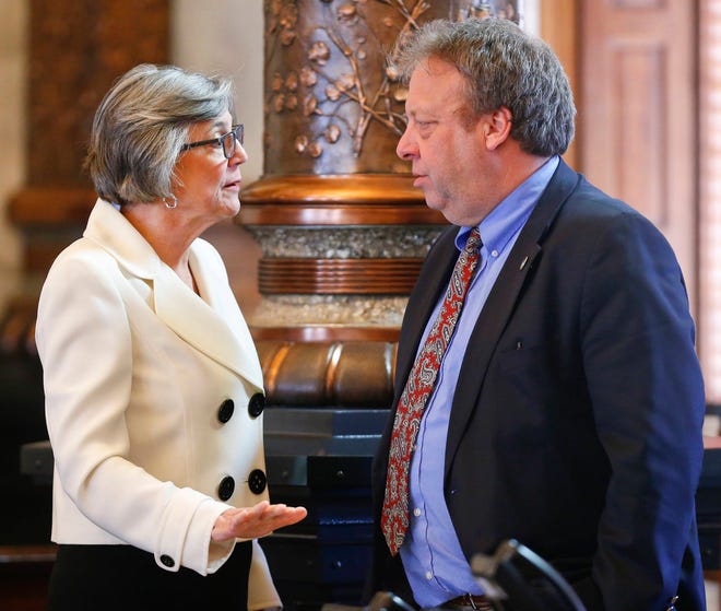 Senate President Susan Wagle, R-Wichita, left, speaks with Sen. Tom Holland, D-Baldwin City, prior to the Senate debating the Governor’s tax bill Tuesday afternoon. (Chris Neal/The Capital-Journal)