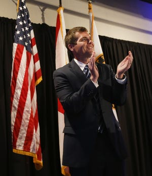 Tuscaloosa Mayor Walt Maddox applauds his supporters at the Hotel Indigo Tuesday after he won re-election. [Staff Photo/Gary Cosby Jr.]
