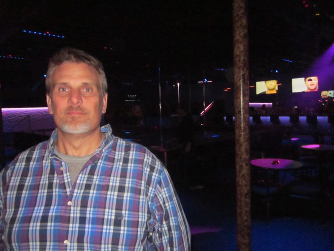 Brett Hartley is shown inside the Grandview Live Gentlemen's Club. News-Journal / Cal Massey