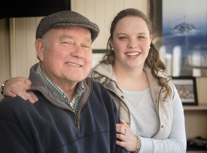 Middletown High School senior Kaitlyn Savage stands with her father, Tom, whose liver transplant in 2015 inspired her senior Capstone project on the importance of organ donation.