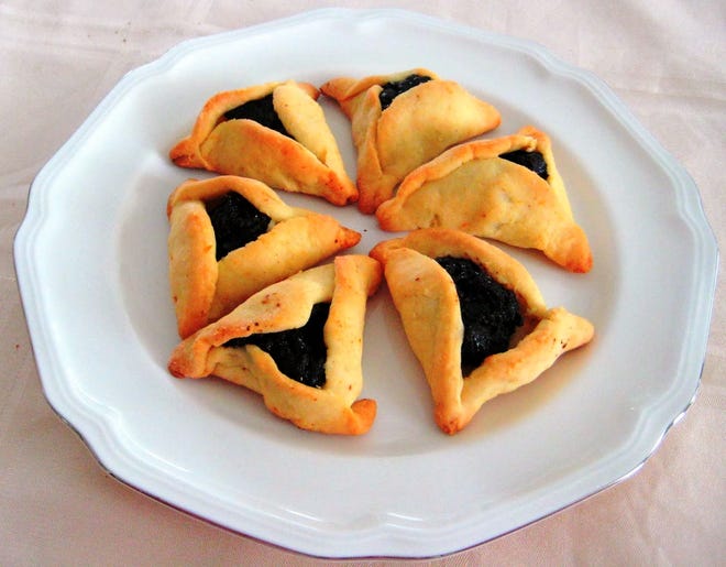 Purim is celebrated March 11-12 to remember the story of Queen Esther of Persia, who risked her life to free the Jewish people from evil Hamen's reign. Children dress as the various characters in the Bible story, and since Haman wore a three-cornered hat, eating these Hamantashen cookies (filled with various jams) symbolizes his defeat.