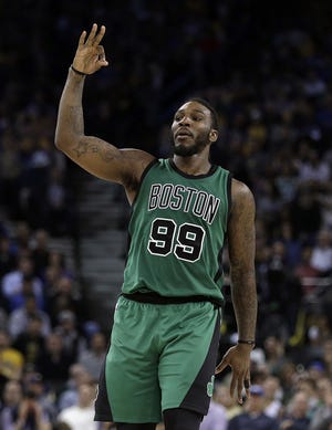 Celtics forward' Jae Crowder celebrates after scoring during Boston's 99-86 win over the Warriors on Wednesday night in Oakland.