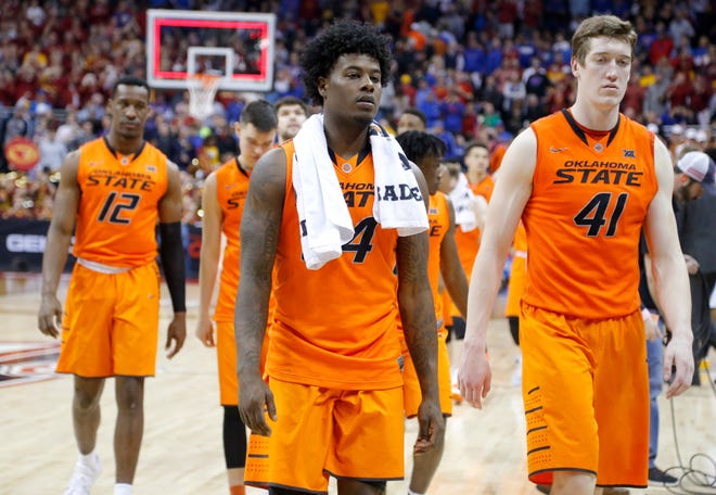 Oklahoma State's Davon Dillard (24) and Mitchell Solomon (41) walks off the court during the Big 12 Tournament college basketball game between the Oklahoma State Cowboys and the Iowa State Cyclones at the Sprint Center in Kansas City , Thursday, March 9, 2017. Photo by Sarah Phipps, The Oklahoman