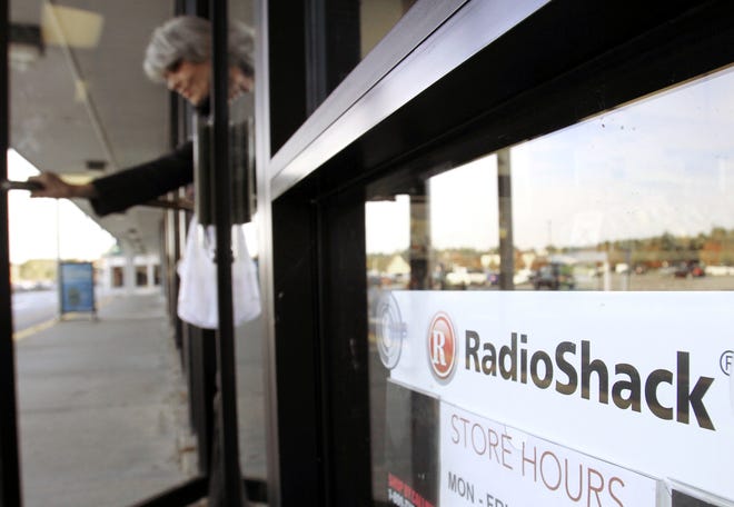 A shopper leaves a RadioShack store. The company has filed for bankruptcy protection for the second time in two years. [ASSOCIATED PRESS ARCHIVE]