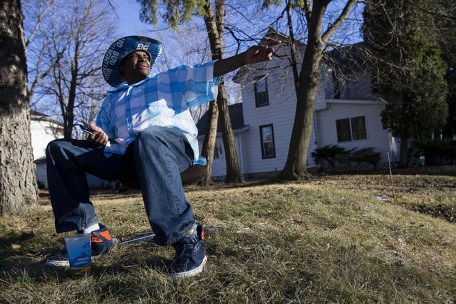 Calvin "King World" Jones talks about the gun violence in his neighborhood Tuesday, Feb. 21, 2017, at the corner of South Liberty Avenue and East Shawnee Street in Freeport. Jones, who lives on the block, washes cars at the corner for a living. [MAX GERSH/THE JOURNAL-STANDARD STAFF]