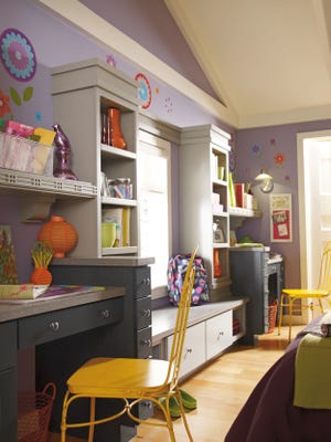 This is a sound example of a wonderful built-in cabinet solution for a shared bedroom. There are two desks for homework and plenty of shelves for books and other items.