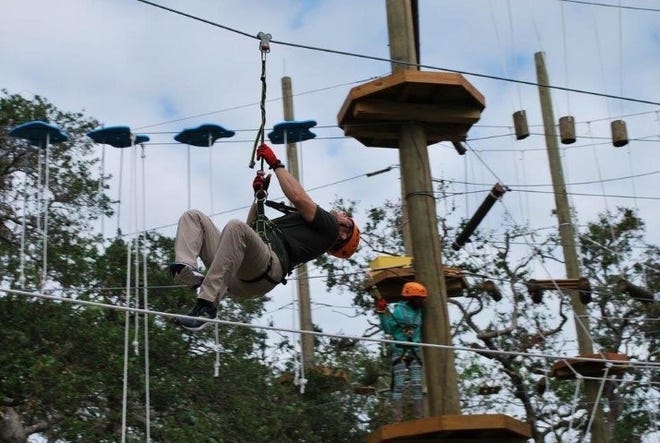 Wounded veterans recently participated in a recovery event throught the WOunded Warrior Project at Cocoa Beach Aerial Adventures zip line and ropes course. [ASSOCIATED PRESS]