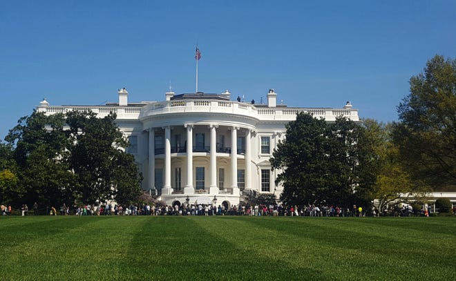 People visit the south lawn during the annual White House Spring Garden tours in Washington on April 17, 2016. The U.S. Secret Service says a person is under arrest after climbing a fence and getting onto the south grounds of the White House. The breach happened at about 11:38 p.m. Friday, March 10, 2017. President Donald Trump was at the White House. (AP Photo/Estelle Doro)
