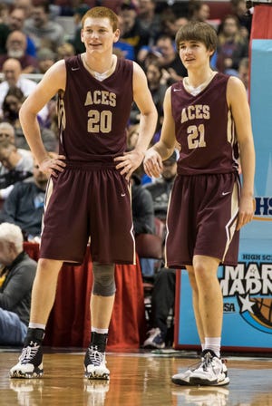 RYAN MICHALESKO/JOURNAL STAR Mt. Carmel's Justin Carpenter (20) and Austin Rager (21) wait for action to start following a timeout during a IHSA Class 2A state semifinal between the Mount Carmel Golden Aces and the Bishop McNamara Fightin' Irish on Friday, March 10, 2017 in Peoria, Ill. The Golden Aces topped McNamara 67-55.