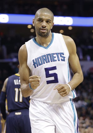 Charlotte Hornets' Nicolas Batum (5) reacts to making a basket against the Indiana Pacers in the first half of an NBA basketball game in Charlotte, N.C., Monday, March 6, 2017. (AP Photo/Chuck Burton)