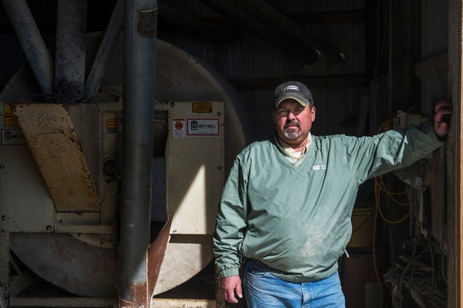 DAVID ZALAZNIK/JOURNAL STAR Curt Zehr pauses on his rural Washington farm Thursday. Zehr and his family have been named the 2017 Family of the Year by the Illinois Pork Producers Association.