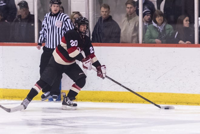 Landon Goguen keeps the puck in at the point for ORR/Fairhaven. Goguen, a senior, anchored a depleted Bulldogs defense that allowed just one goal to Rockland. [RYAN FEENEY/STANDARD-TIMES SPECIAL/SCMG]