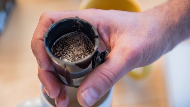 An attempt to strengthen the coffee by compacting a finer grind of beans into a reusable pod failed when the water wouldn’t pass through. Dixie D. Vereen for The Washington Post