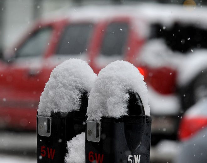 Parking meters on South Main Street are a good indicator of snow depth.