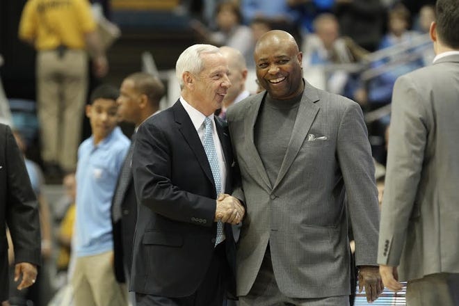 Florida State coach Leonard Hamilton (right) greets North Carolina coach Roy Williams before their Jan. 14 game in Chapel Hill won by North Carolina 96-83. [PHOTO BY BRIAN MAYHEW/SPECIAL TO THE GAZETTE]