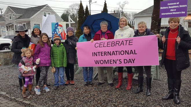 Women and children gathered in York Village last Wednesday morning to march in support of International Women's Day. [Deborah McDermott/Seacoastonline]