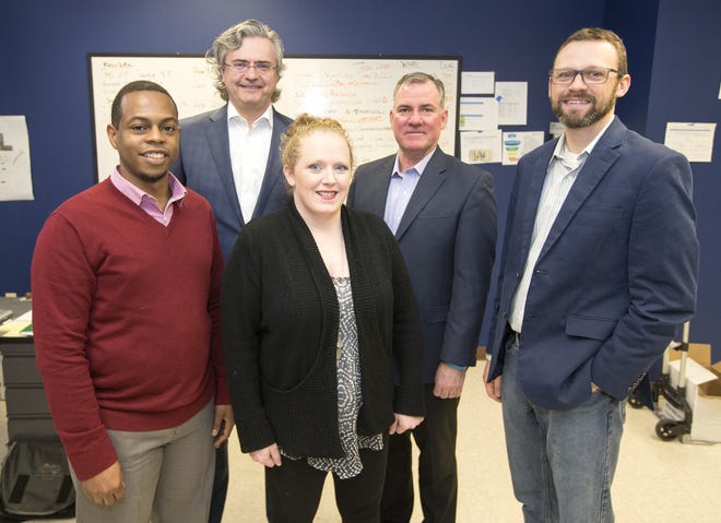The team at Transform Rockford (from left to right) David Sidney, project manager; Mike Schablaske, executive director; Lindsay Halley, office manager; Patrick O'Keefe, communications manager; and Jacob Wilson, program director, has a goal to make the region a top 25 community by 2025. They were photographed at the Transform Rockford office Tuesday, Jan. 24, 2017. [ARTURO FERNANDEZ/TRANSFORM 815 & RRSTAR.COM STAFF]