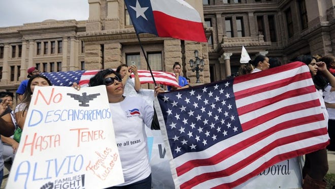 Protesters take part in a “No Ban, No Wall” rally on Feb. 28 at the Capitol in downtown Austin to oppose a border wall and legislation dismantling so-called sanctuary cities.