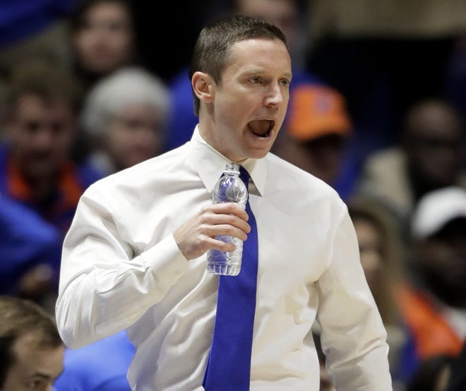 FILE - In this Friday, March 10, 2017, file photo, Florida head coach Mike White watches the action during the first half of a game against Vanderbilt on Friday at the Southeastern Conference Tournament in Nashville, Tenn. Although Florida is a top-four seed playing two hours from home, the Gators feel like an underdog heading into the NCAA Tournament. [AP Photo / Wade Payne, File]