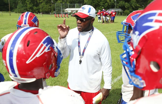 Linden head coach Andro Williams gives direction to players during preseason practice in Linden on Aug. 9, 2016. After a decade at the helm of the Linden High School football program, Williams is headed to Class 4A W.S. Neal. [Staff file photo/Erin Nelson]