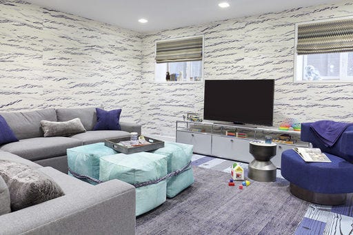 This undated photo provided by Jenny Kirschner shows a basement designed by the New York-based interior designer. Cheerful color and cozy furnishings with warm, soft upholstery transform this basement designed into an inviting and family-friendly space. (Ryan Dausch/Jenny Kirschner via AP)