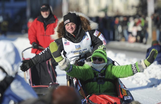 Iditarod rookie Laura Neese greets the crowd on March 4, before the start of the Iditarod Trail Sled Dog Race in Anchorage, Alaska. (AP Photo/Michael Dinneen)