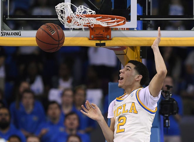 UCLA guard Lonzo Ball dunks during a game against Washington State on March 4 in Los Angeles. Ball, who could be the No. 1 pick in the NBA draft this year, is one of the players worth watching in the NCAA Tournament. [AP Photo / Mark J. Terrill]