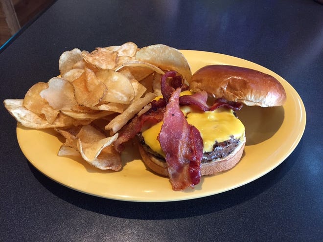 The bacon cheeseburger with house chips at The Creek Pub & Grill.